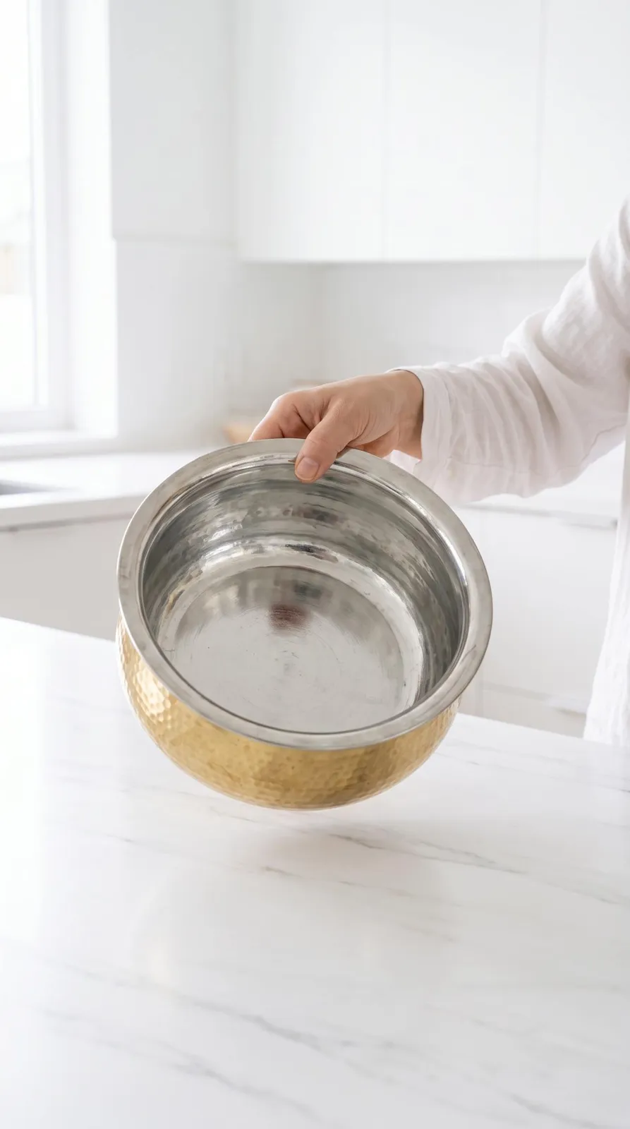 Empty brass patila with clean tin-lined inside